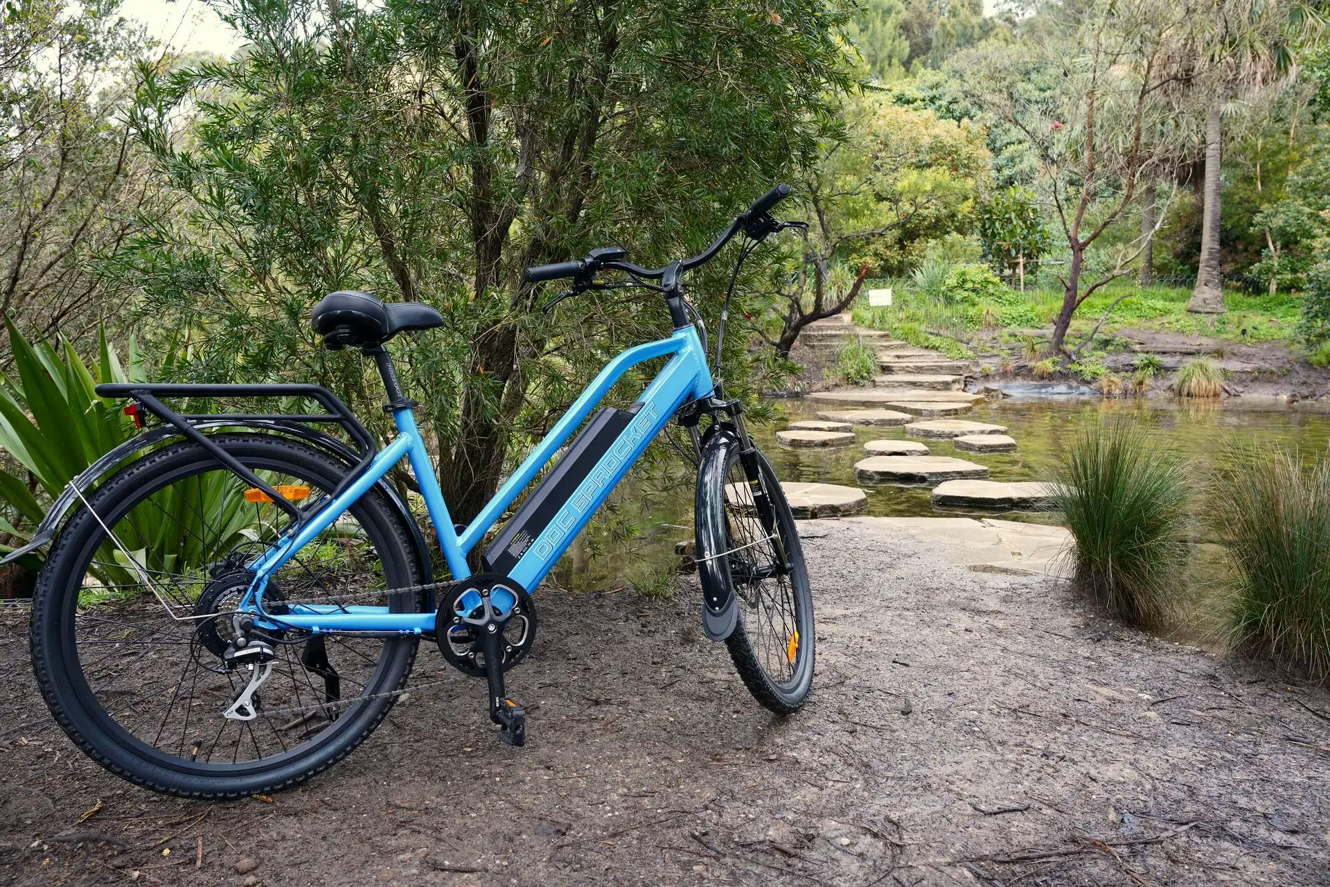 image of a blue ebike in a forest